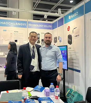 H96 Max Team Posing with Clients at Hong Kong Electronics Trade Show