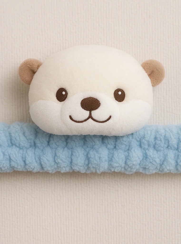 Diadema para bebé con nutria de peluche – diseño suave y amigable