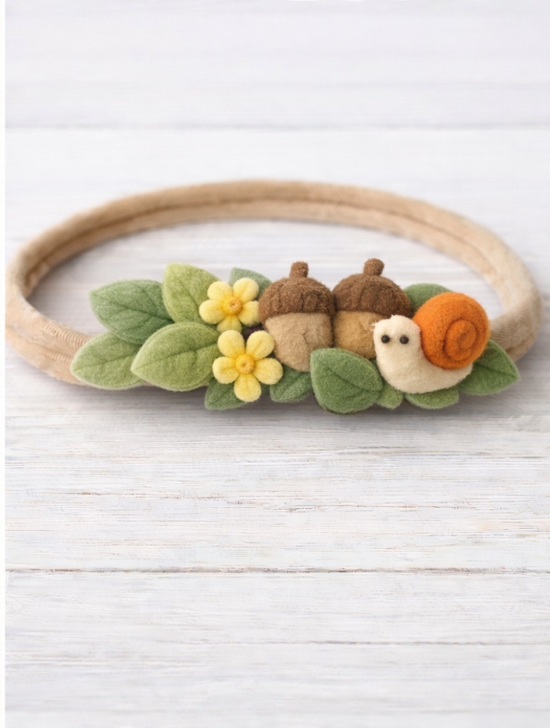 Diadema adorável de caracol e bolotas para bebês