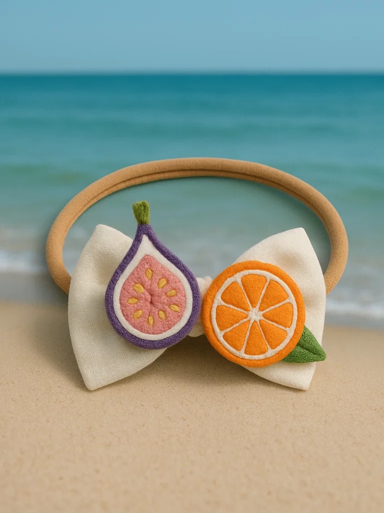 Bandeau pour bébé avec jouets en peluche figue et orange