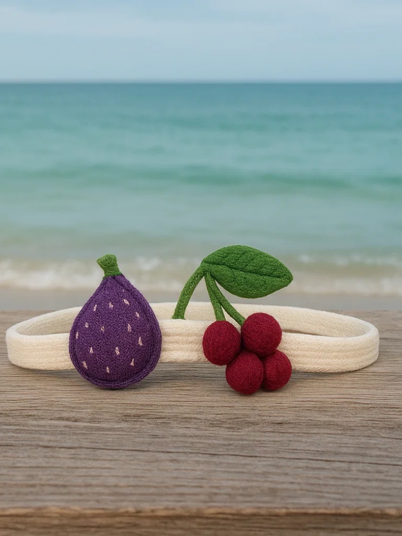 Bandeau pour bébé avec jouets en peluche figue et raisin
