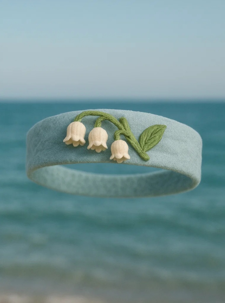 Soft Baby Headband with White and Green Floral Embellishments