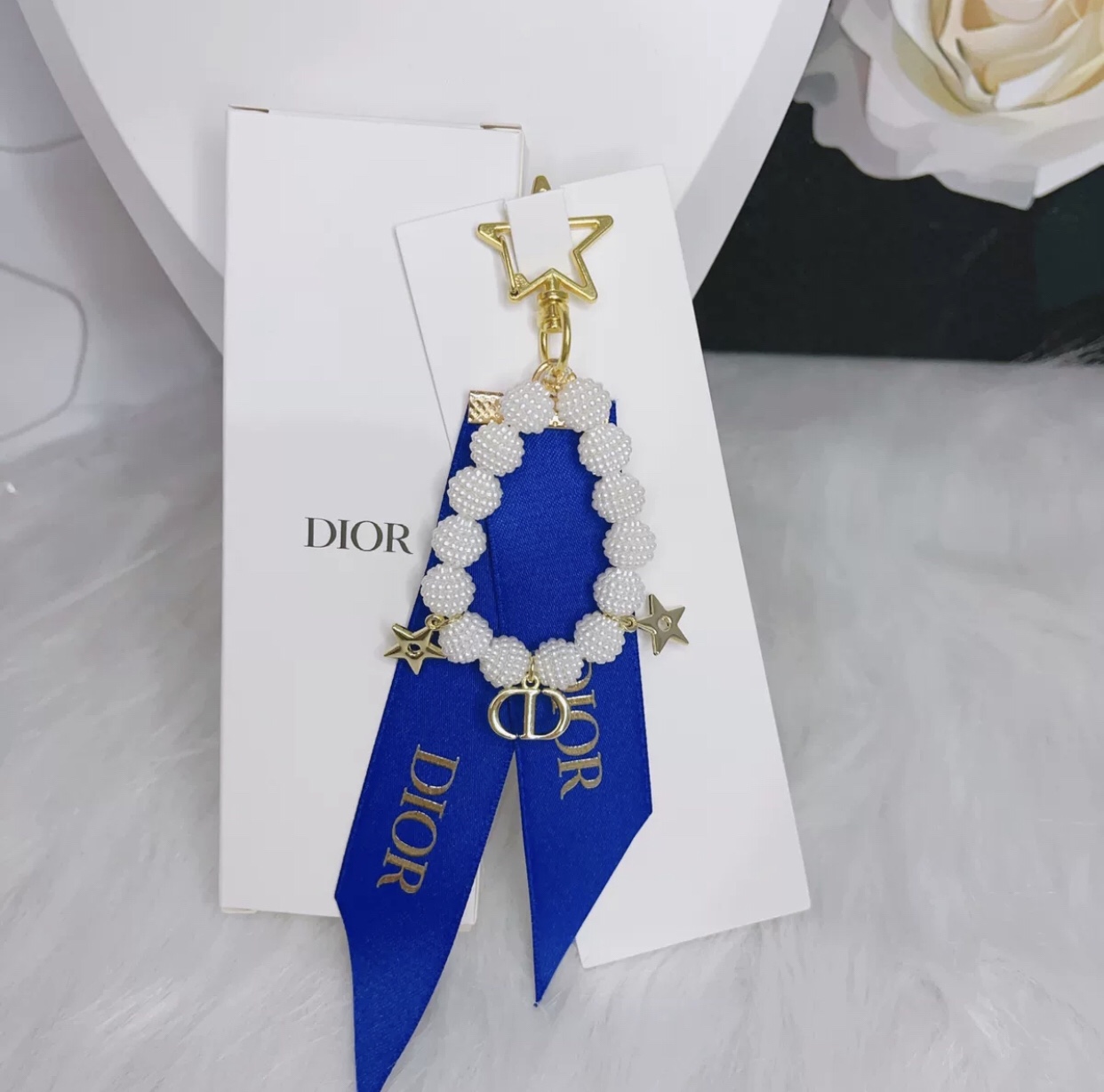 blue dior keychain