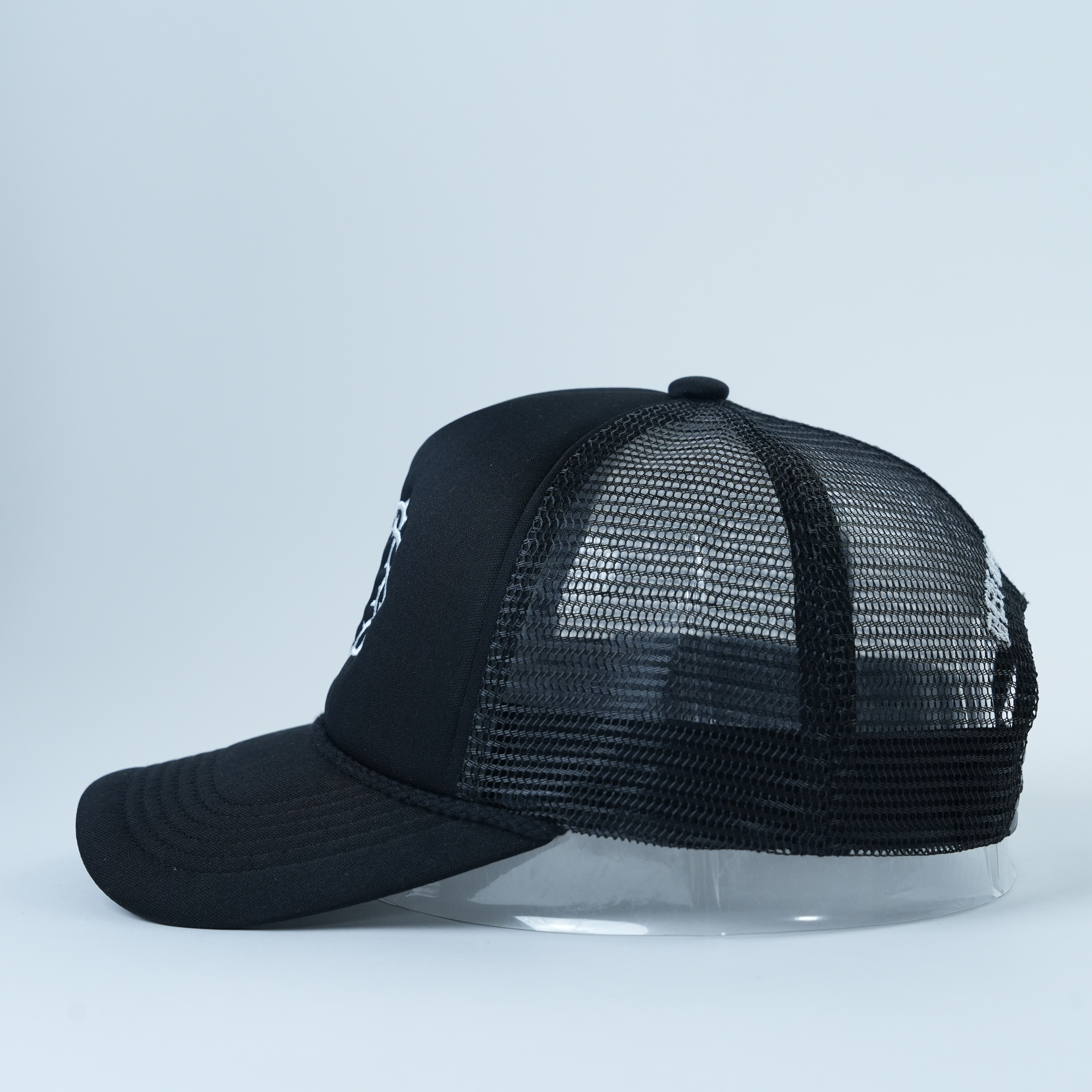 Black Mesh Trucker Hat with Eye Symbol Flat Embroidery