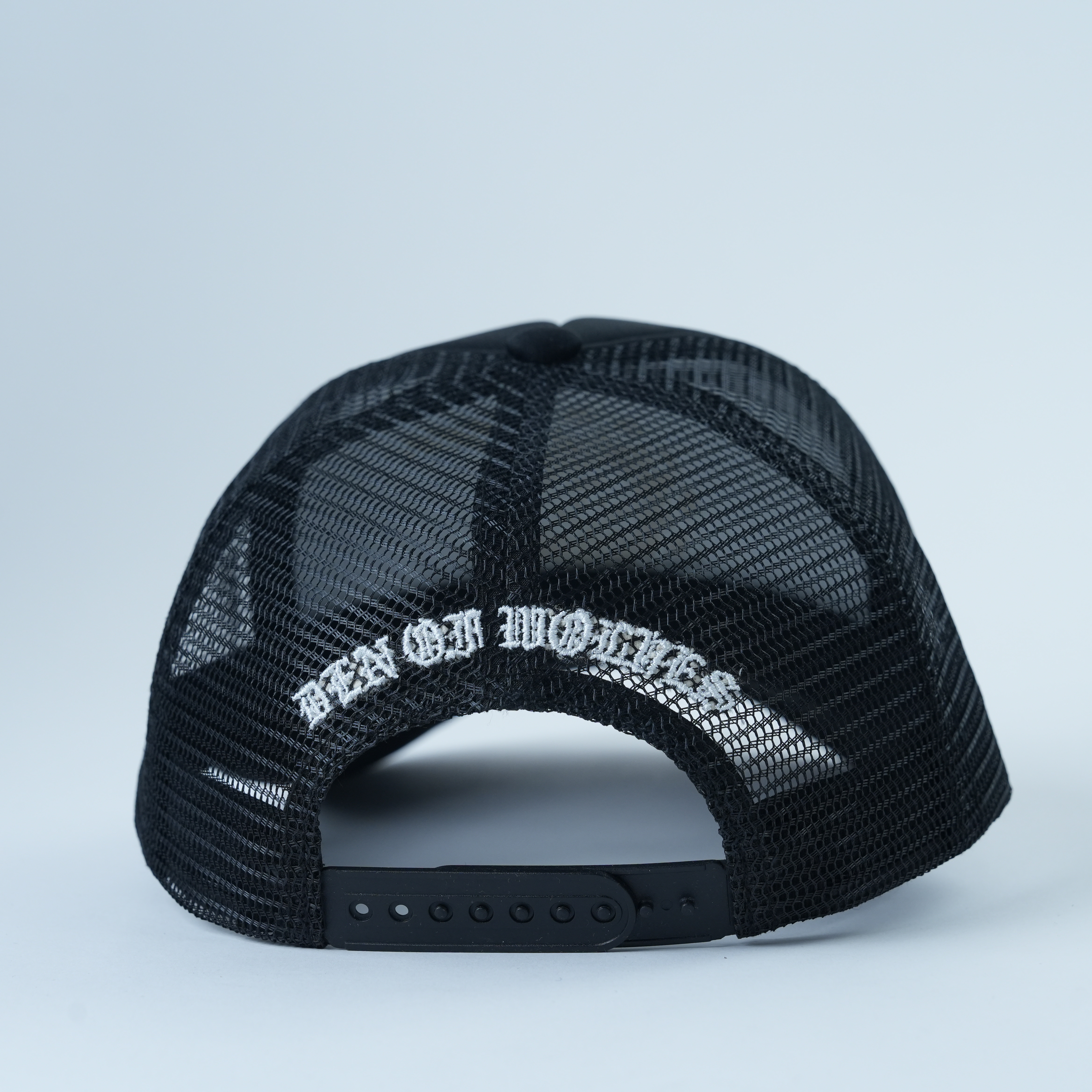 Black Mesh Trucker Hat with Eye Symbol Flat Embroidery
