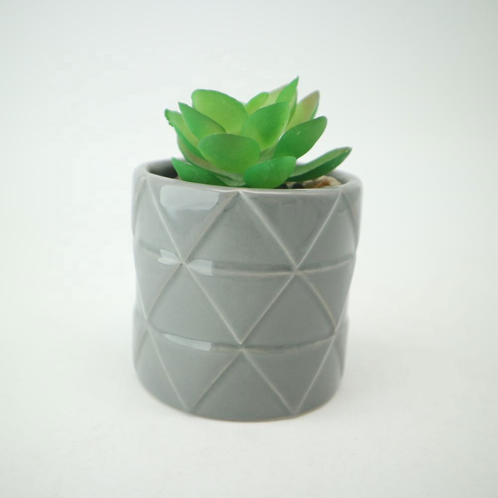 Small Ceramic Pot with Natural Touch Faux Succulent potted with simulated soil.