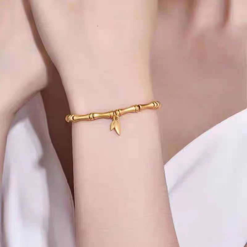 Gold Bamboo Segment Bracelet with Leaf Charm – Elegant Titanium Steel Jewelry