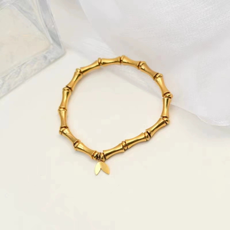 Gold Bamboo Segment Bracelet with Leaf Charm – Elegant Titanium Steel Jewelry