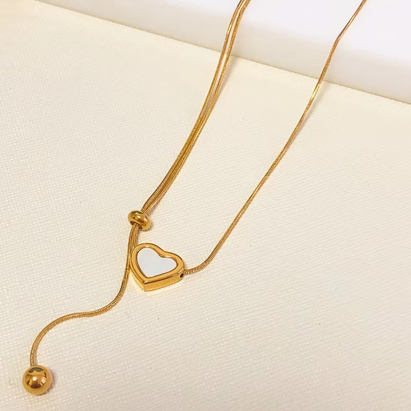 Adjustable Gold Heart Pendant Necklace with White Enamel Accent