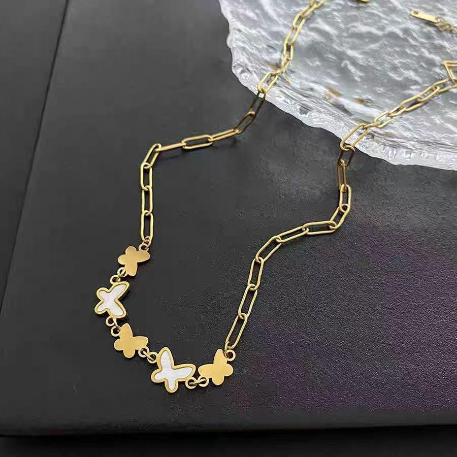 Butterfly Charm Statement Necklace – Trendy Gold Chain Jewelry for Women with White Enamel Inlay