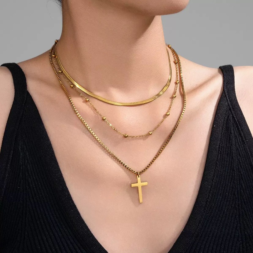 Layered Gold Titanium Steel Necklace with Cross Pendant and Gold Bead Accents