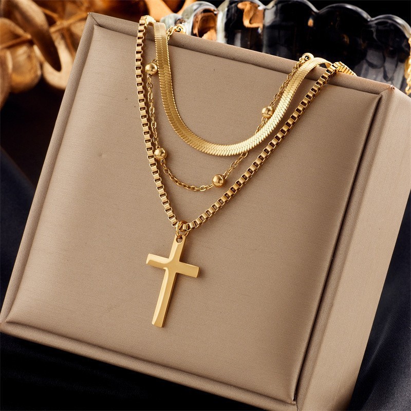 Layered Gold Titanium Steel Necklace with Cross Pendant and Gold Bead Accents