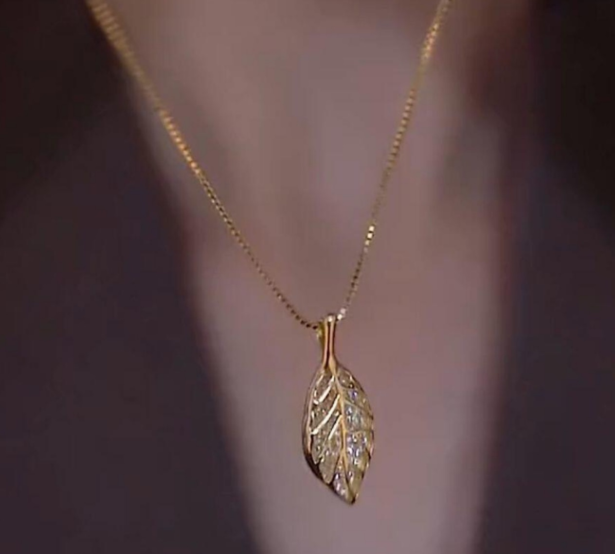 Gold Leaf Pendant NecklacFour-Leaf_Clover_Pendant_Necklace_Elegant_Gold_Lucky_Charm_Jewelrye - Elegant Nature-Inspired Jewelry for Women