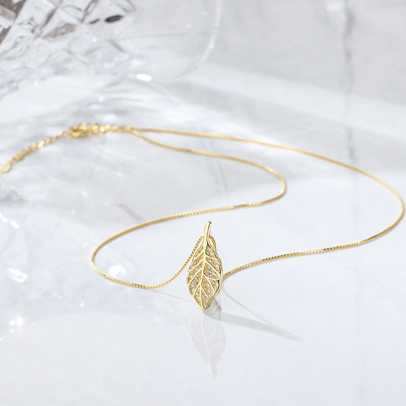 Gold Leaf Pendant NecklacFour-Leaf_Clover_Pendant_Necklace_Elegant_Gold_Lucky_Charm_Jewelrye - Elegant Nature-Inspired Jewelry for Women