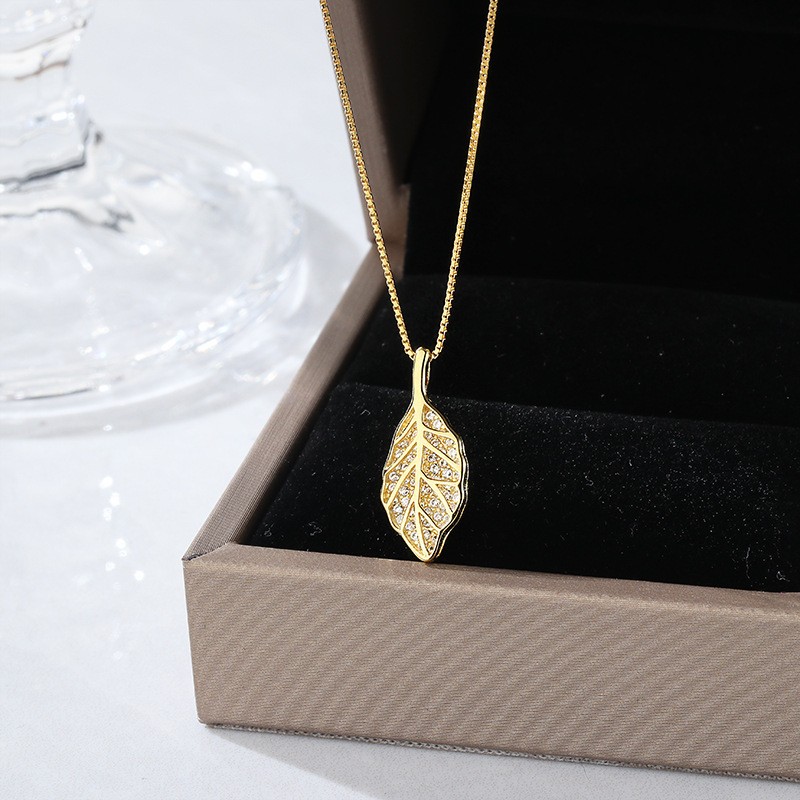 Gold Leaf Pendant NecklacFour-Leaf_Clover_Pendant_Necklace_Elegant_Gold_Lucky_Charm_Jewelrye - Elegant Nature-Inspired Jewelry for Women