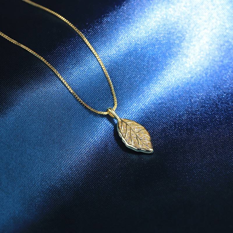 Gold Leaf Pendant NecklacFour-Leaf_Clover_Pendant_Necklace_Elegant_Gold_Lucky_Charm_Jewelrye - Elegant Nature-Inspired Jewelry for Women