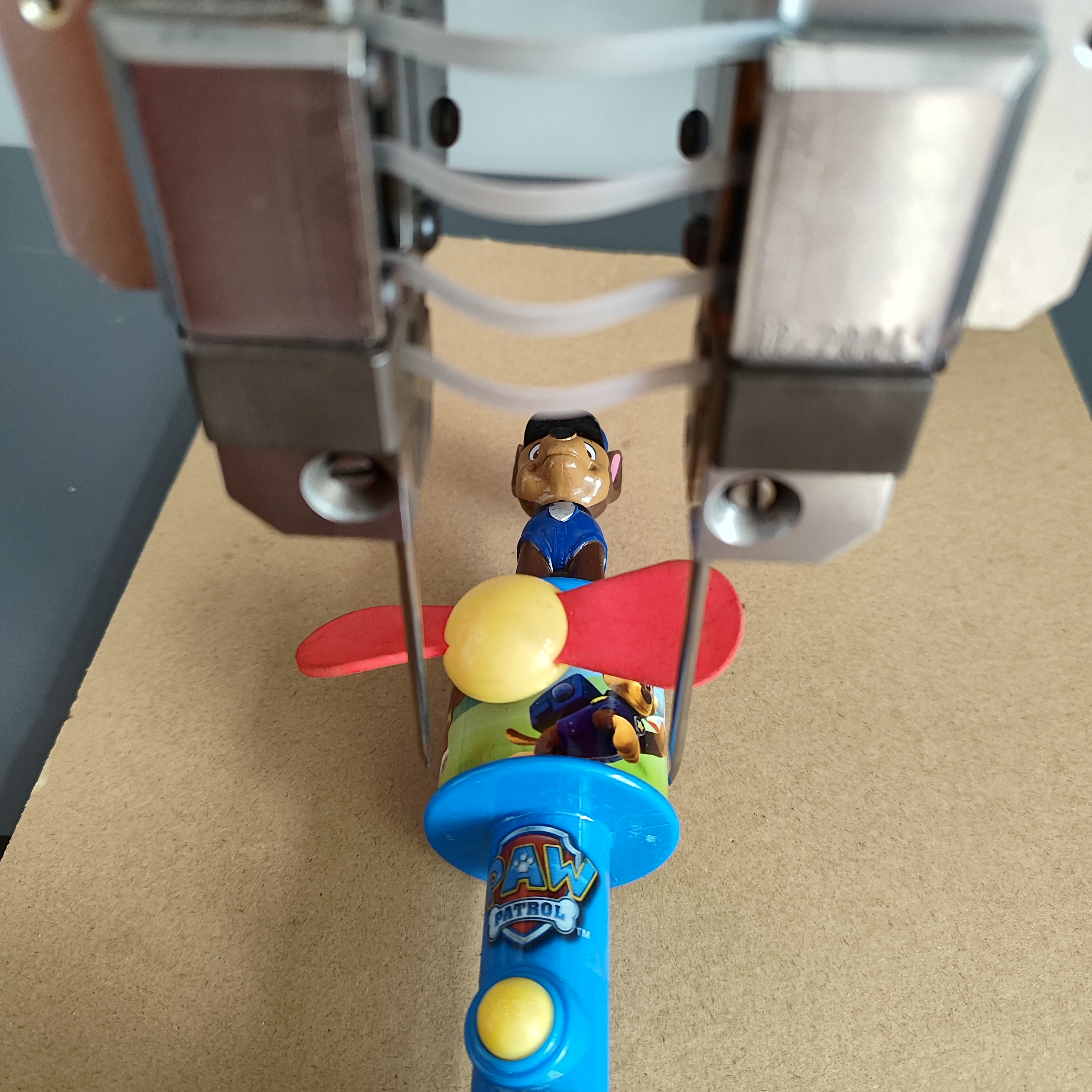 Automated Elastic Staple Machine for Toy Doll Packaging & Display Fixation