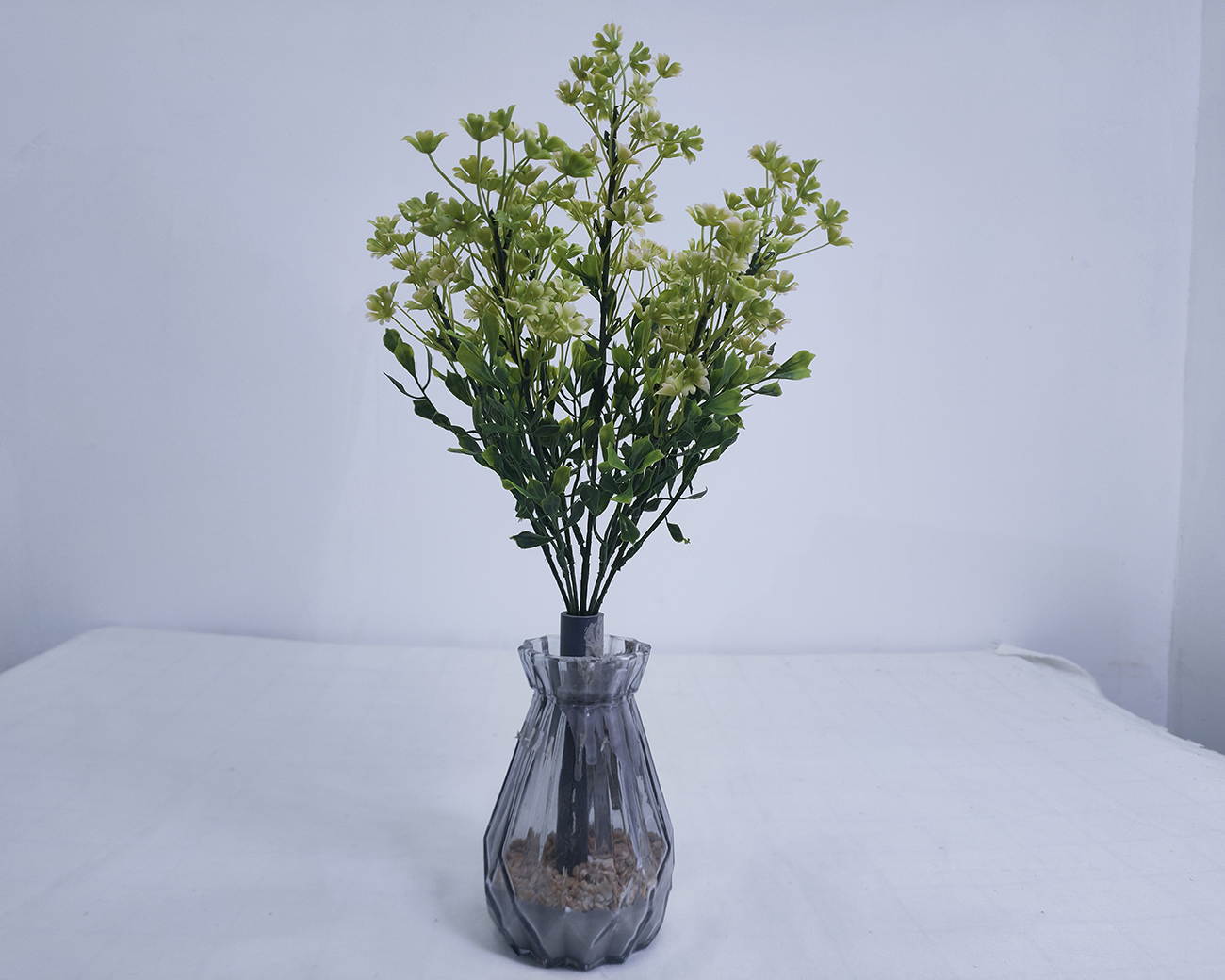 Simulated tree head with leaves and flowers in water
