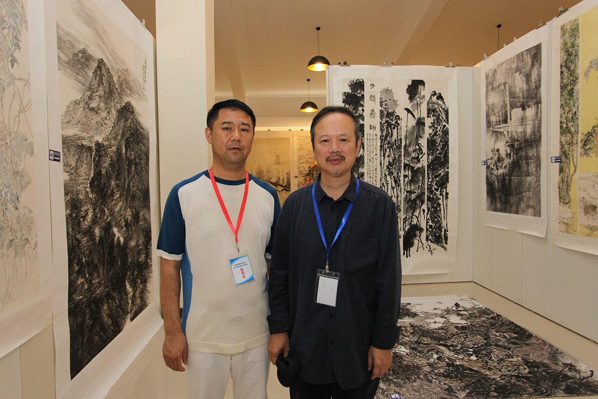 昌宇集团董事长李刚与中国著名画家田黎明-合影